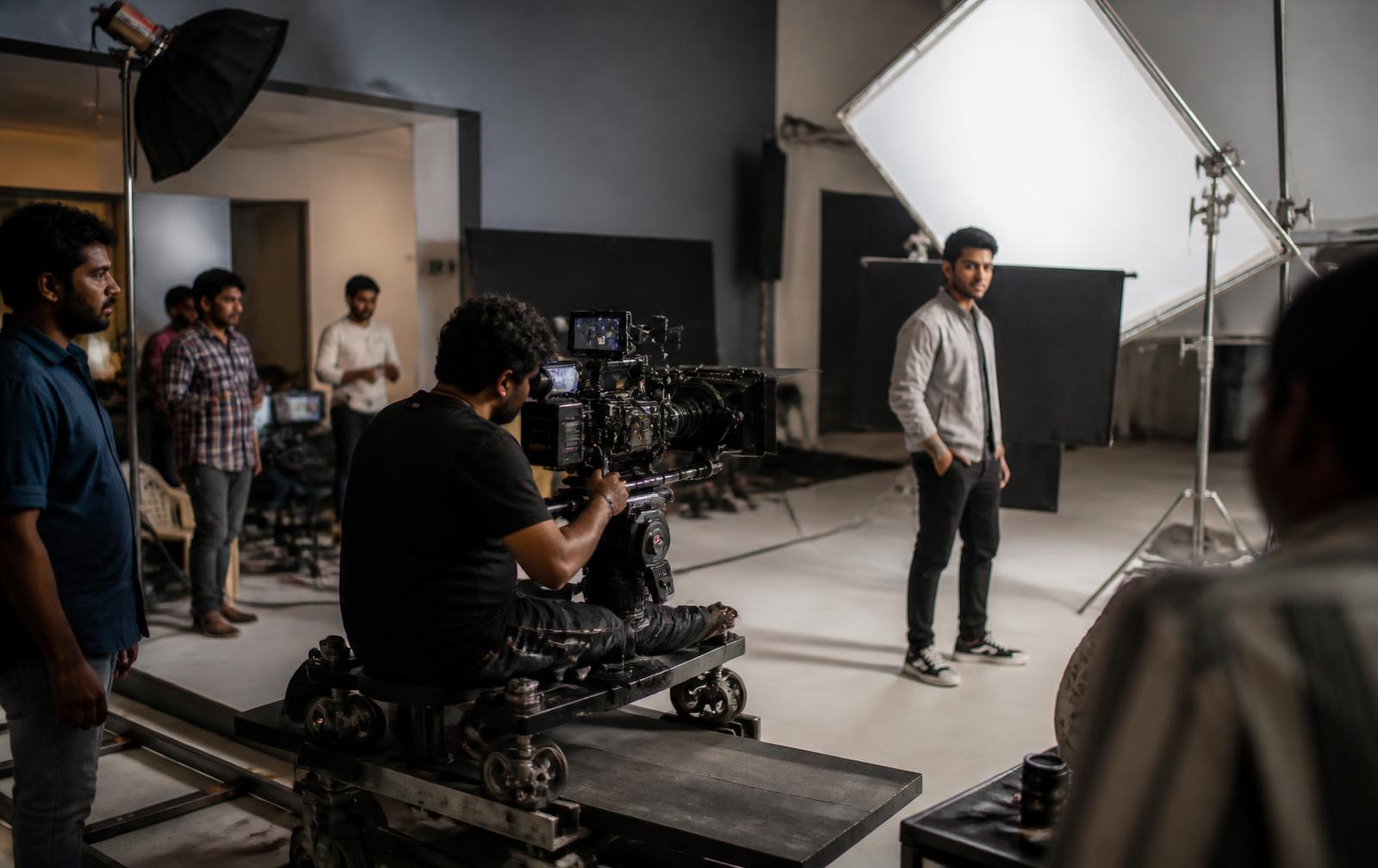 Commercial film set with crew and lighting during a brand shoot